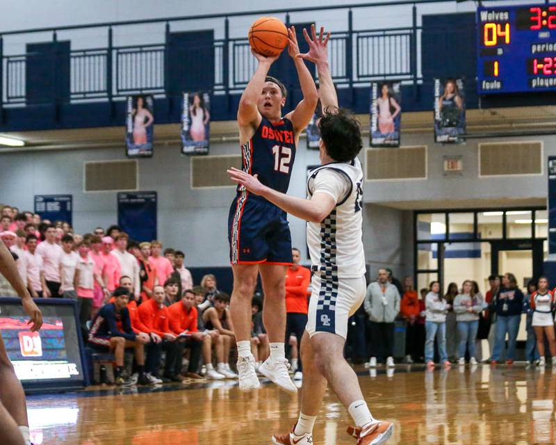 Oswego's Graham Schwab (12) shoots a jump shot during their basketball game between Oswego at Oswego East, Feb 13, 2026 in Oswego.
