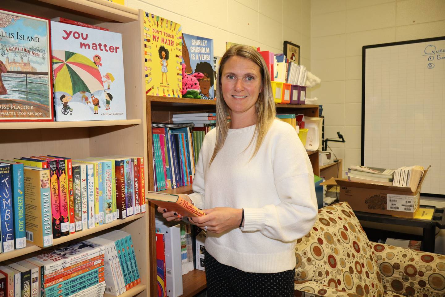 Sheena Manola, a Marine Corps veteran. is an English language arts instruction coach at Edna Keith and Farragut elementary schools in Joliet.