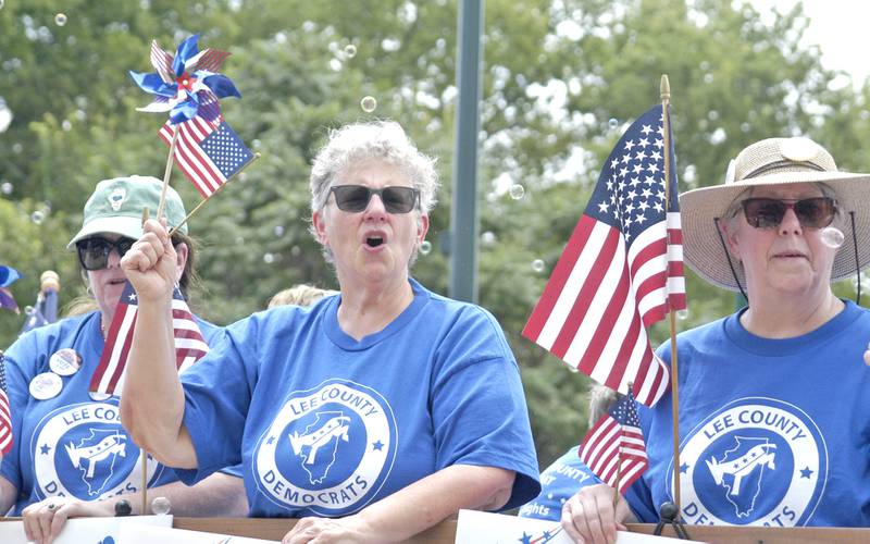 The Lee County Democrats ride in the Petunia Festival parade Sunday, July 6, 2025.