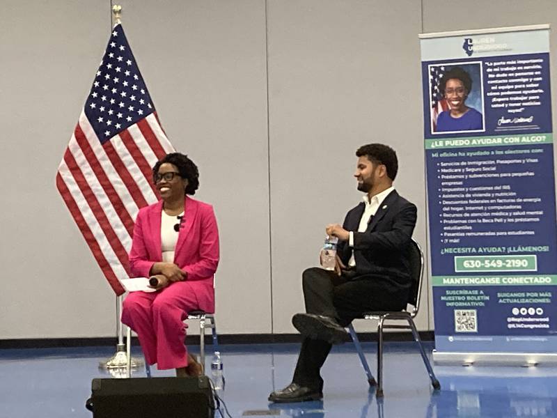 Representative Lauren Underwood of Illinois' 14th District and Representative Maxwell Frost of Florida's 10th District speak to a crowd at Jones Elementary School in Joliet on Saturday, May 31, 2025.