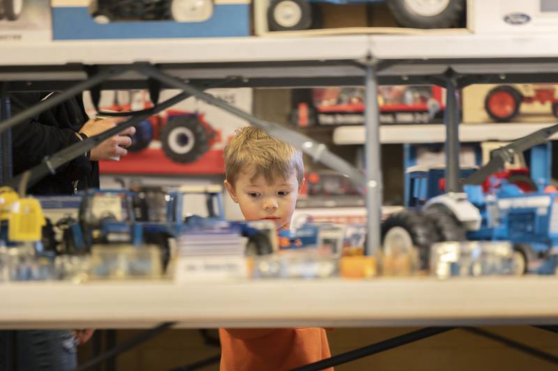 Brody Leffelman, 5, of Sublette checks out the racks and racks of tractors, cars, trucks and other things Sunday, March 15, 2026, at the Sublette Antique Tractor and Toy Show.