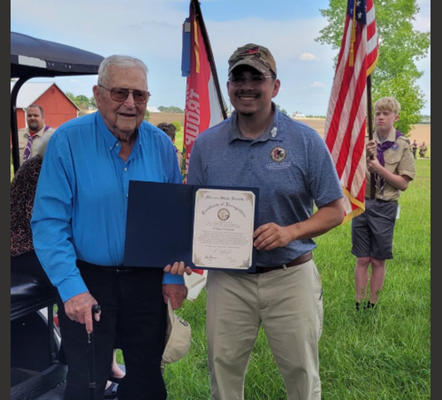 Willard Simpson (left) is presented with a certificate honoring his World War II service Saturday in Franklin Grove. State Sen. Li Arellano Jr. (right) presented the certificate to Simpson.