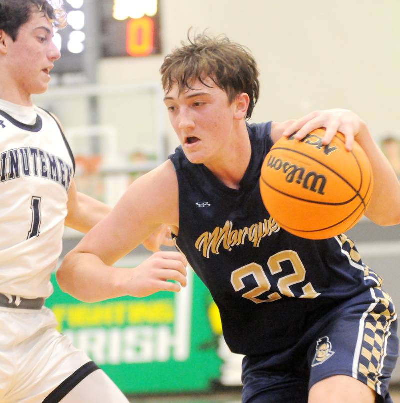 Marquette's Griffin Dobberstein (22) pushes towards the basket as Lexington's Blaine Friedmansky defends in the Shipyard Showdown semifinals on Friday, Dec. 26, 2025 in Seneca.