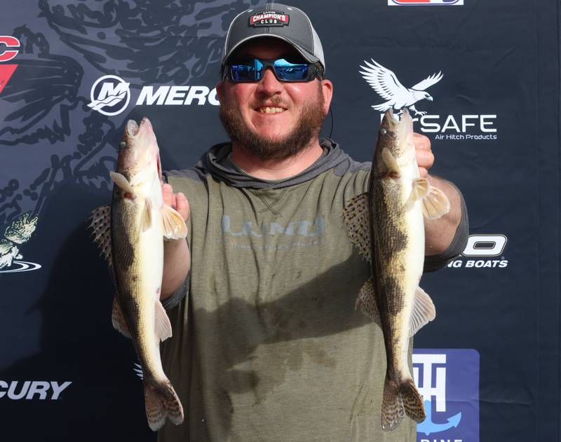 Ryan Feldott of Spring Valley, smiles while holding up his sauger fish that he caught during the annual Masters Walleye Circuit tournament on Friday, March 20, 2026 at the Spring Valley Boat Club.