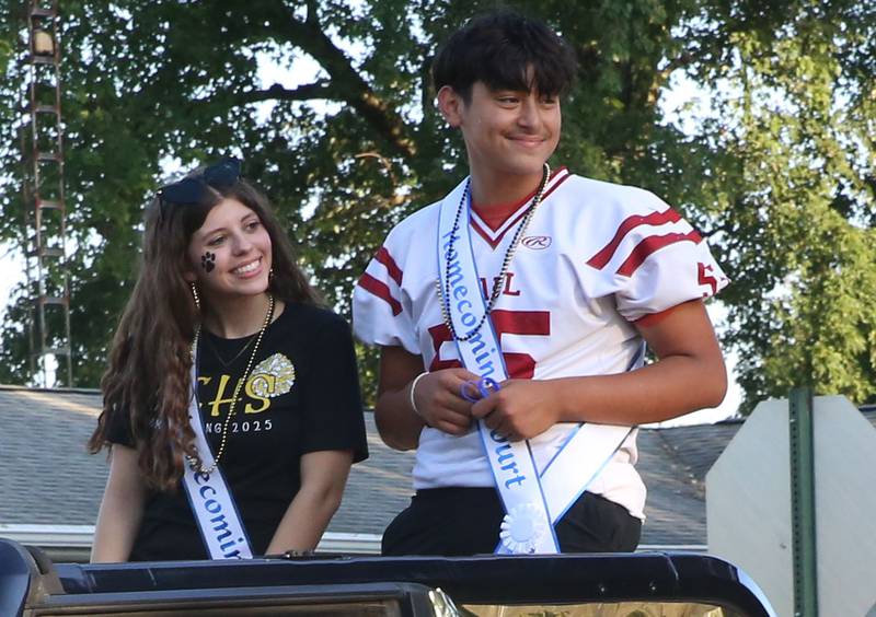 Putnam County High School freshman court students Naomi Hammerich and Jesus Ramirez ride during the inaugural Homecoming parade on Wednesday, Sept. 17, 2025 down Elm Street in Granville.