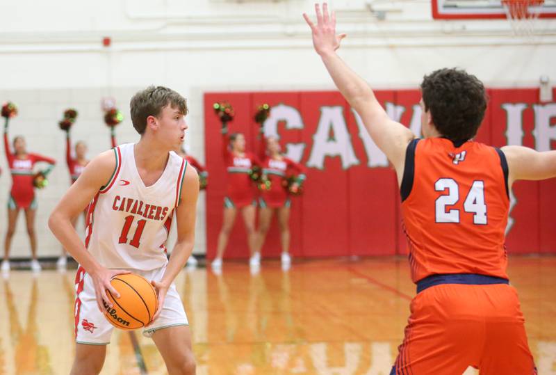 L-P's Jameson Hill looks to pass around Pontiac's Henry DeYoung on Tuesday, Dec. 17, 2024 in Sellett Gymnasium at L-P High School.