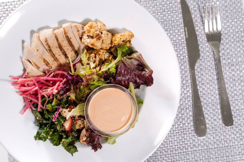 Seattle Sutton’s buffalo chicken salad offers a balanced, filling meal.