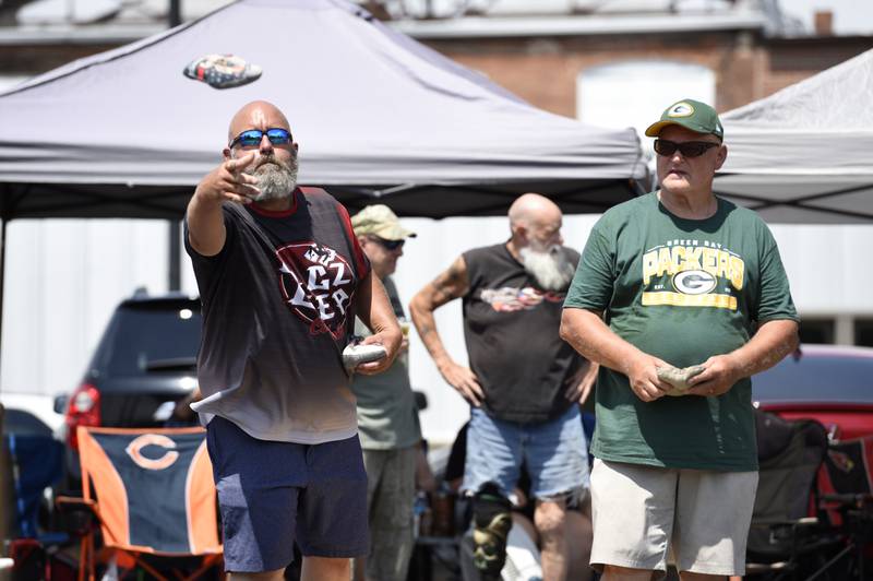 Troy Stevens, left, of Hoopeston, and Gary Stelter, right, of Cedar Lake, Ind., compete in the cornhole tournament in Momence on Sunday, August 10, 2025. The tournament was the largest of it's kind for the area with 162 participants.