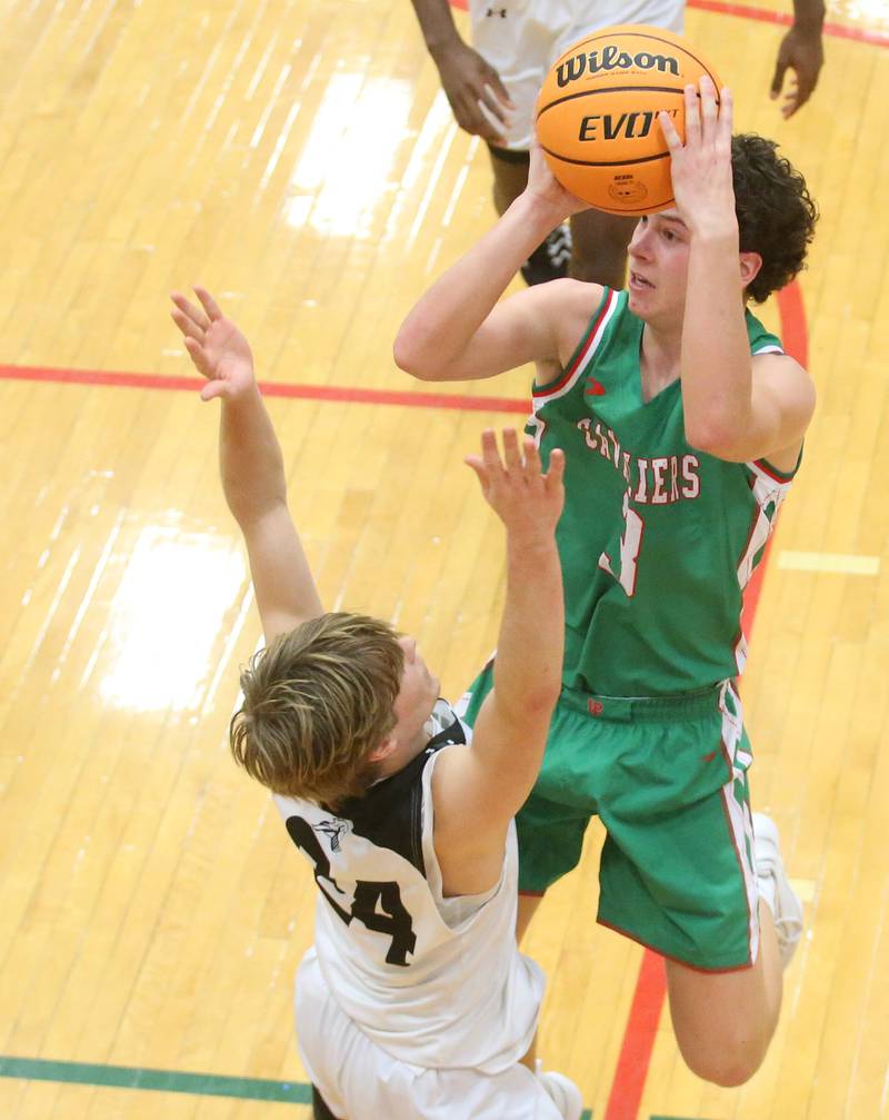 L-P's Mikey Hartman shoots a jump shot over Kaneland's Luke Reinert on Friday, Jan. 31, 2025 in Sellett Gymnasium at L-P High School.