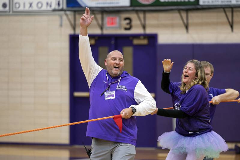 Principal Jared Shaner celebrates a teacher tug-of-war win Friday, Sept. 27, 2024, at Dixon High School against a freshmen squad.