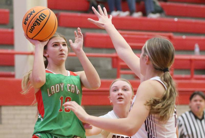 L-P's Kelsey Frederick shoots a shot over Metamora's Baylie Nena during the Ottawa Girls Holiday Tournament on Monday, Dec. 16, 2024 in Kingman Gym at Ottawa High School.