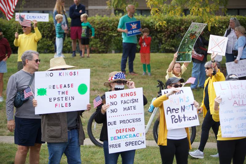 Locals gather at the NO Kings rally along Randall Rd. on Saturday, Oct.18,2025 in Geneva.