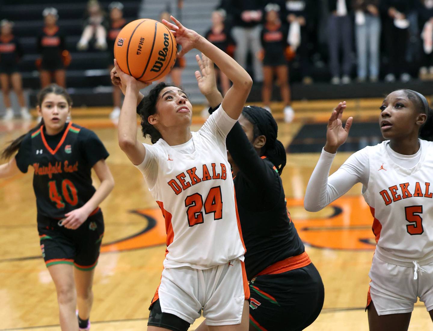 DeKalb's Nazeria Dean gets a shot up in front of a Plainfield East defender Thursday, Feb. 12, 2026, during their game at DeKalb High School.