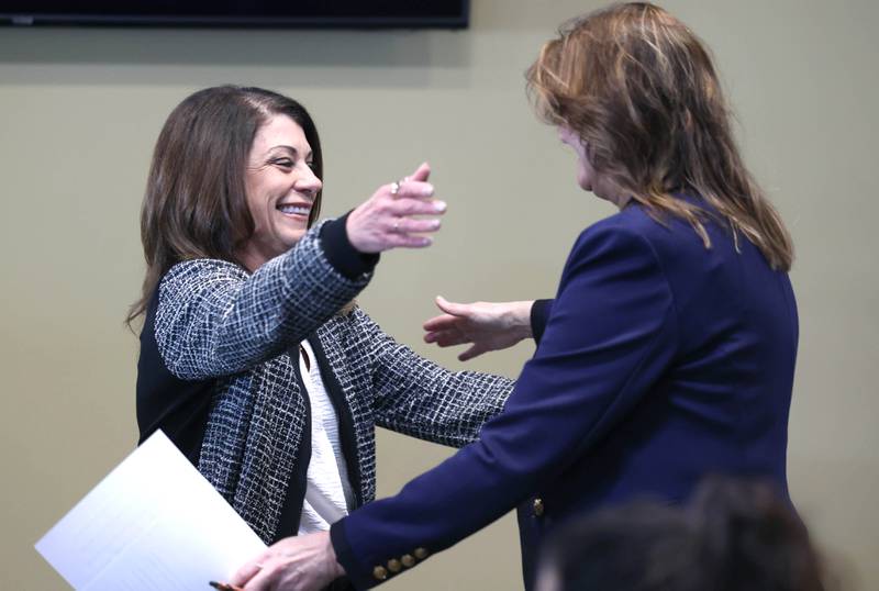 Cortney Strohacker, (left) Executive Director of the DeKalb County Convention and Visitors Bureau, introduces Melissa Amedeo, DeKalb County Economic Development Corporation executive director, Wednesday, March 25, 2026, during the DCEDC annual economic outlook luncheon Wednesday at Faranda’s Banquets in DeKalb.