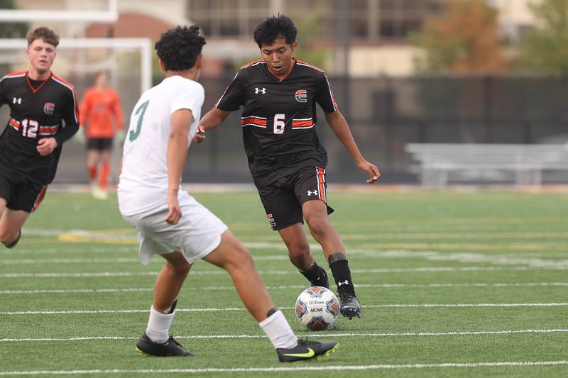 Plainfield East’s Joshua Rojas works the ball against Plainfield Central on Tuesday, Sept. 19, in Plainfield.