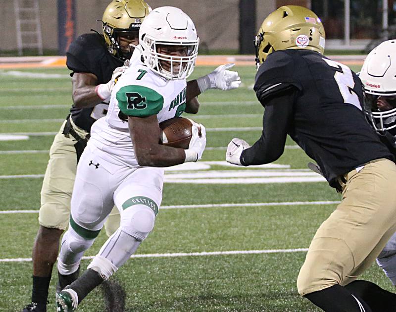 Providence Catholic's Jamari Tribett (7) carries the ball as Sacred Heart-Griffin's Richard Jackson (24) and Colin Johannes (2) defend in the Class 4A state title on Friday, Nov. 25, 2022 at Memorial Stadium in Champaign.