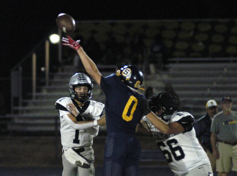 Sterling's Wyatt Cassens attempts to block a Galesburg pass. The Galesburg Silver Streaks traveled to Sterling to take on the Warriors at Prescott Memorial Field at Roscoe Eades Stadium, September 26, 2025.