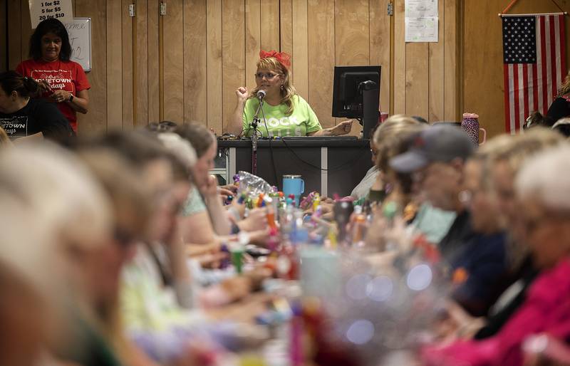 Bingo caller Bonnie Matthews belts out the numbers Thursday, Nov. 21, 2024, to over 450 players who signed up for the Rock Falls Chamber event.