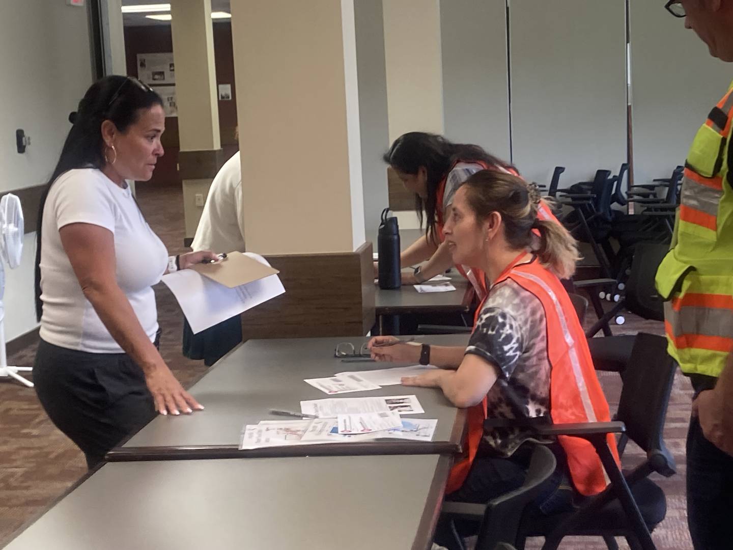 Will County Emergency Management Agency employees simulate the verification process of a "parent" during an emergency training program for first responders and local school personnel at University of St. Francis in Joliet on Wednesday, July 23, 2025.