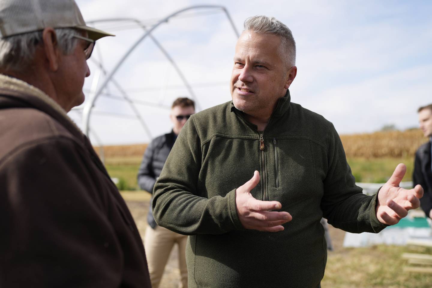 Congressman Eric Sorensen, right, talks with Denny Van Daele as he joins Rock Island County farmers and Illinois Farm Bureau leaders at a family farm in Taylor Ridge, Ill., Monday, Oct. 14, 2024. They discussed the status of the farm bill, the effects of severe weather on farms, and Sorensen's efforts on behalf of Illinois producers. (AP Photo/Nam Y. Huh)