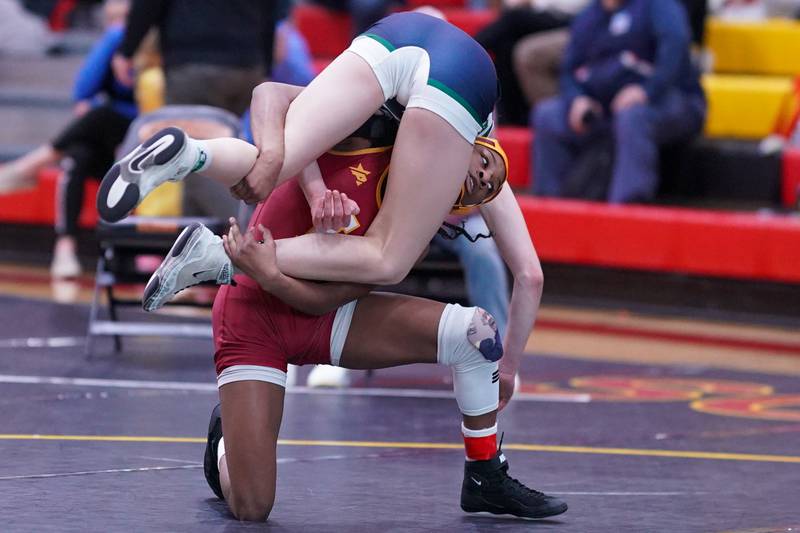 Lockport’s Morgan Turner lifts Bartlett’s Emma Engels off the mat during a 110 pound championship match in the Schaumburg Girls Wrestling Sectional at Schaumburg High School on Saturday, Feb 10, 2024.