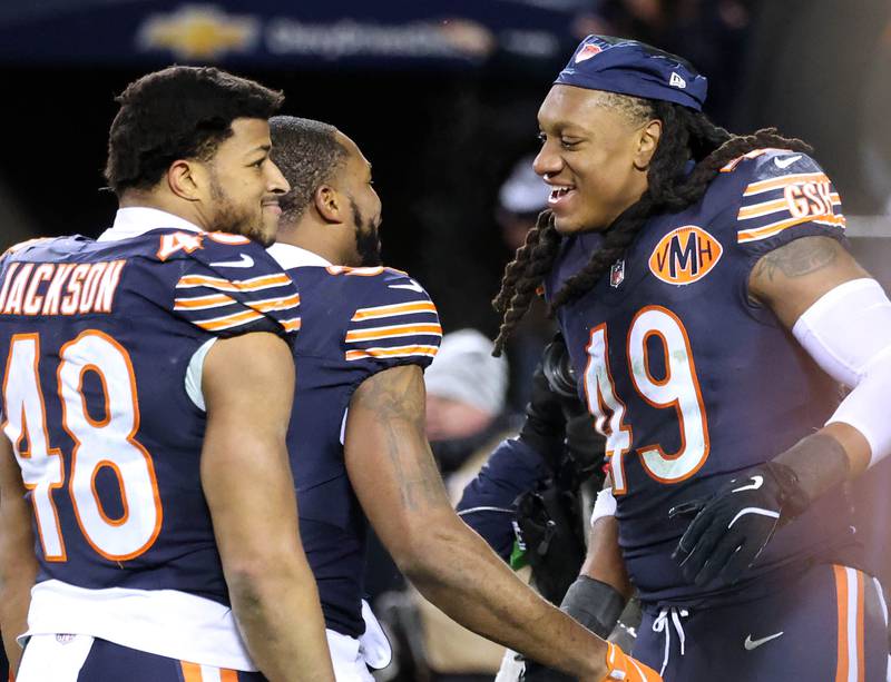 Chicago Bears linebacker D'Marco Jackson (left) and linebacker Tremaine Edmunds celebrate after the Bears 31-27 win over the Green Bay Packers in the NFL Wild Card game Saturday, Jan. 10, 2026, at Soldier Field in Chicago.