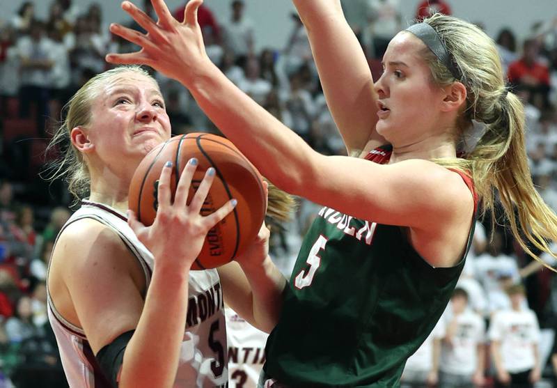 Montini's Victoria Matulevicius turns into Lincoln's Kloe Froebe as she looks to shoot during their game Friday, March 1, 2024, in the IHSA Class 3A state semifinal at the CEFCU Arena at Illinois State University in Normal.