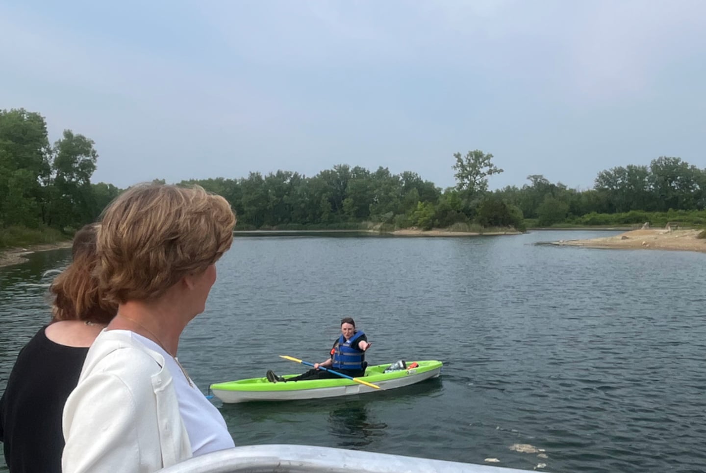 Bri Gulbrandsen of the McHenry County Conservation District demonstrates the new accessible kayak launch on June 12, 2025, at The Hollows Conservation Area in Cary.
