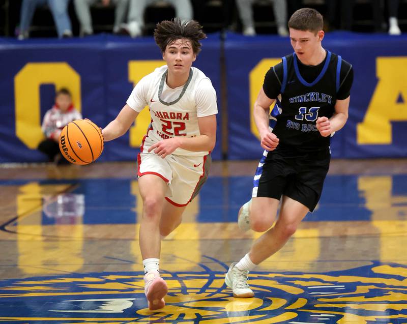 Aurora Christian's Jacob Baumann pushes the ball ahead of Hinckley-Big Rock's Jacob Orin during their sectional final game Friday, March 7, 2025, at Somonauk High School.