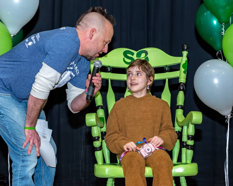 Josh Thomas onstage with Gwen at the St Baldricks Foundation event for Gwen Cola at Forest Road Elementary School in La Grange Park. March 23, 2023.