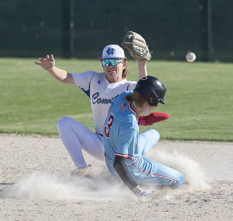 Newman’s Garet Wolfe can’t handle the throw as Hall’s Max Bryant slides in safe at second base Monday, April 15, 2024 at Newman High School.