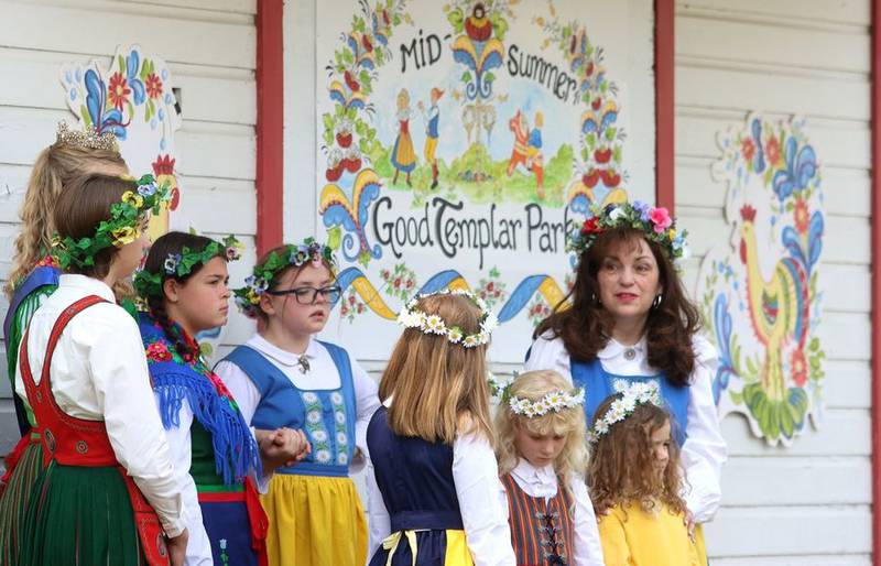 Members of the Swedish American Children's Choir assemble to perform during the 113th Swedish Day Midsummer Festival at Good Templar Park in Geneva Sunday. The choir will also be appearing on the MainStage at Geneva's Swedish Days Festival later this week.