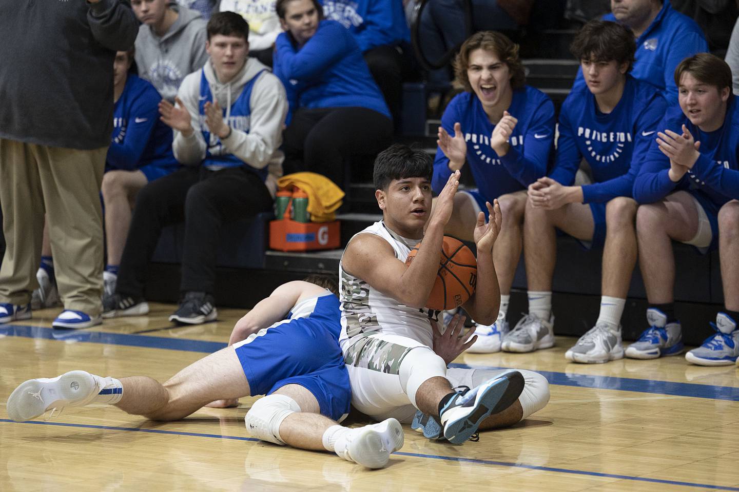 Newman’s Gabe Padilla calls for time after scrambling for a loose ball against PrincetonFriday, Jan. 13, 2023.