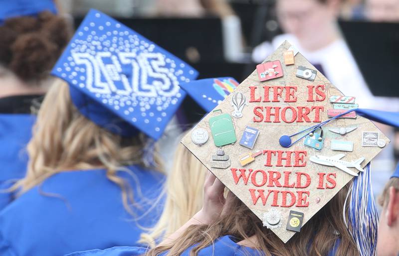 A Princeton High School student's cap reads "life is short, the world is wide" during the 156th annual Commencement on Saturday, May 17, 2025 at Bryant Field.