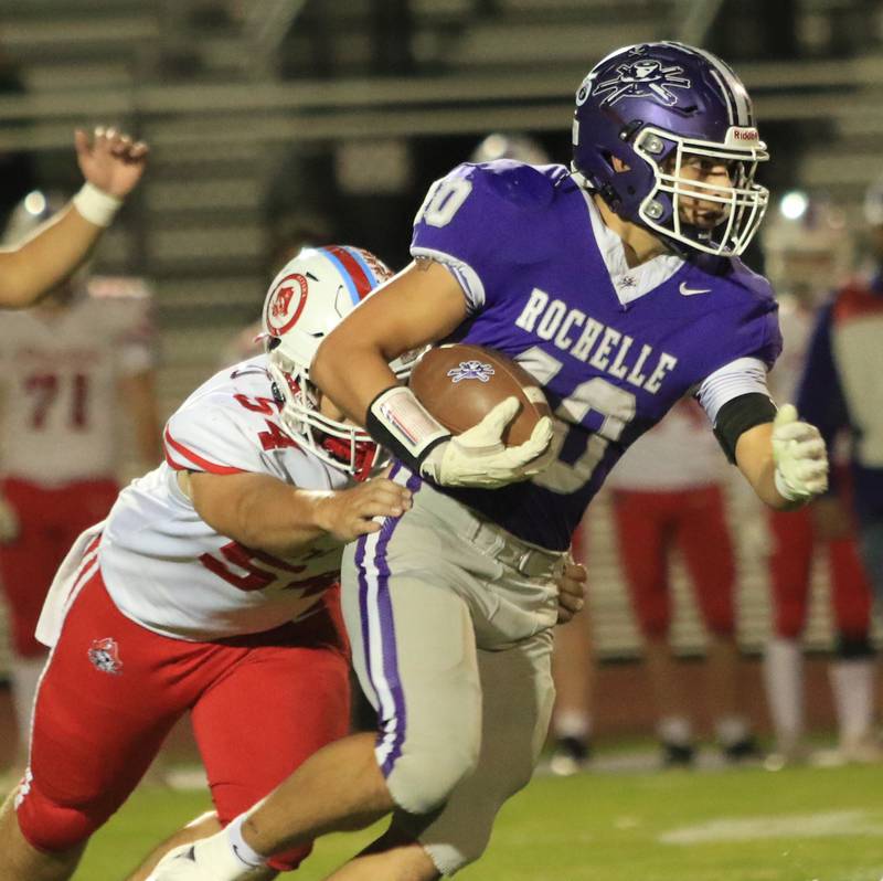 Rochelle's Roman Villalobos (40) runs the ball during Friday's game with Ottawa in Rochelle.
