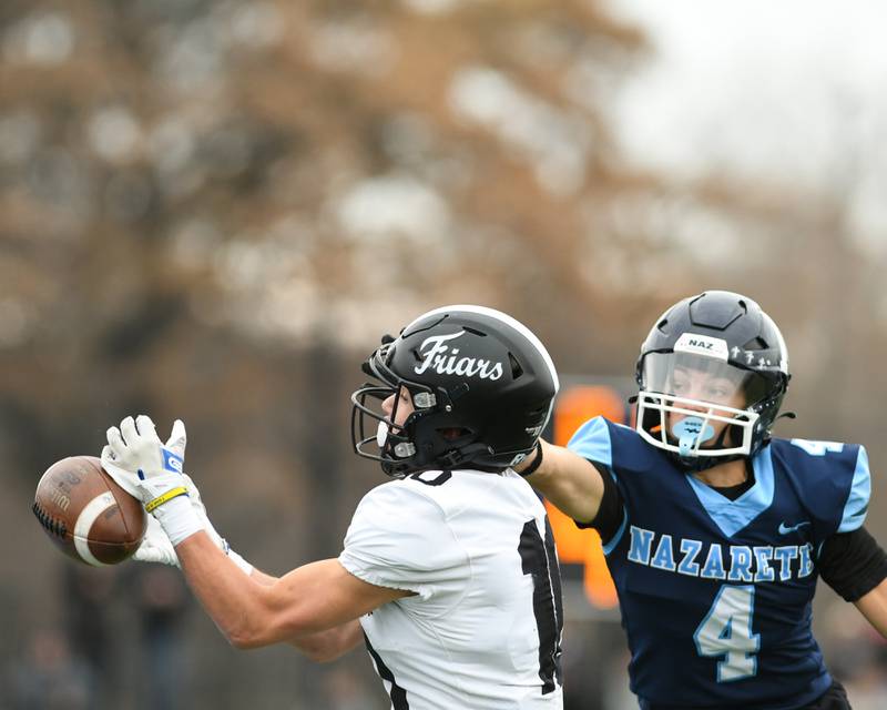 Fenwick's Will Tomczak (10) catches the ball while being defended y Nazareth Academy's Frankie Nichols (4) during the 6A semifinals game on Saturday Nov. 22, 2025, held at Nazareth Academy High School in La Grange Park.