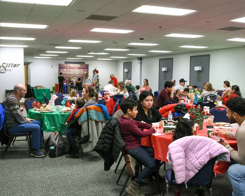 Attendees enjoy some breakfast and greeting Santa during the breakfast with Santa event held on Sunday Dec. 15, 2024, at the La Grange Park District Recreation Center.