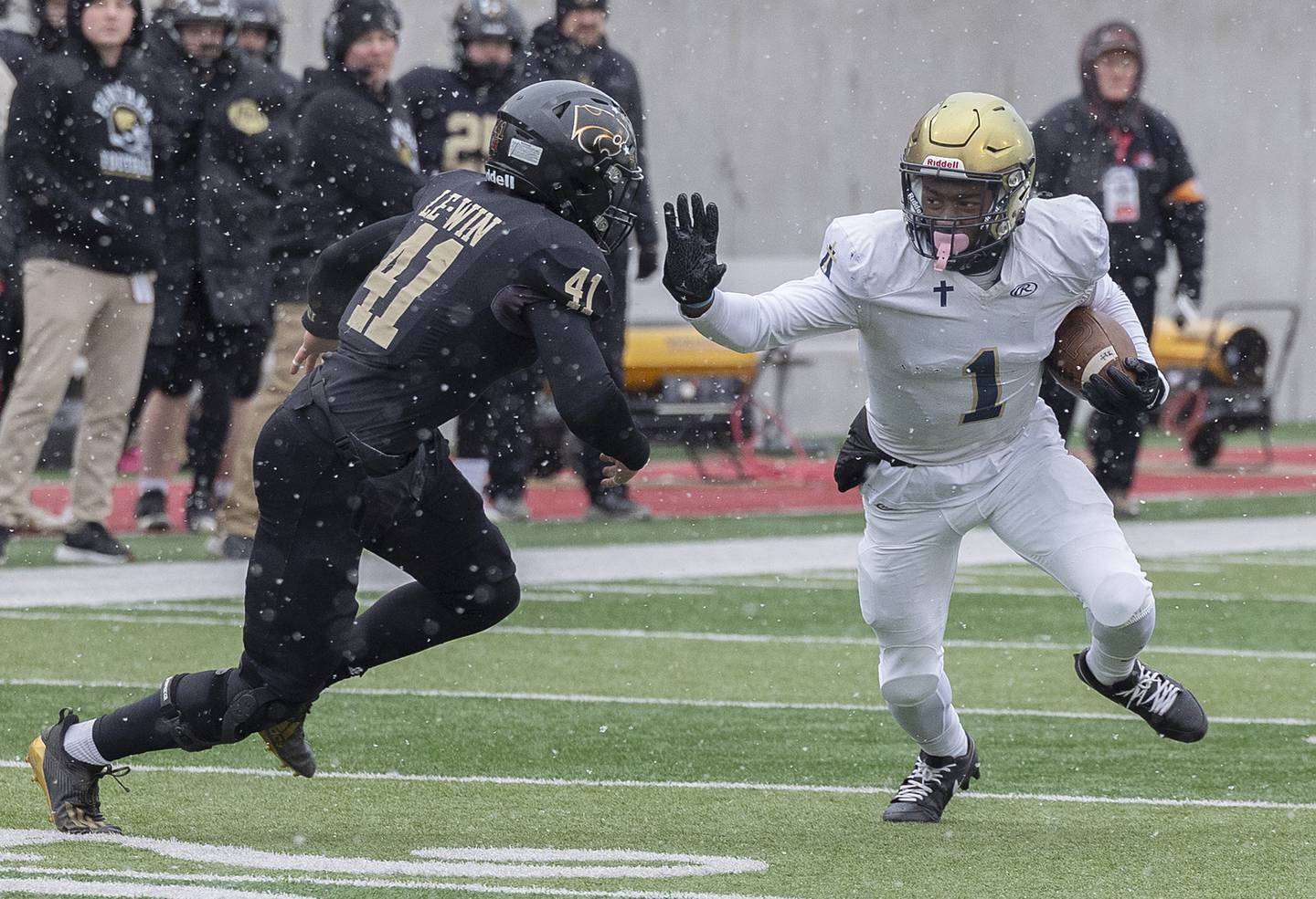 Althoff Catholic’s Charleston Coldon makes a catch and works against Lena-Winslow's Cobryn Lynch Friday, Nov. 29, 2024, in the class 1A football state final.
