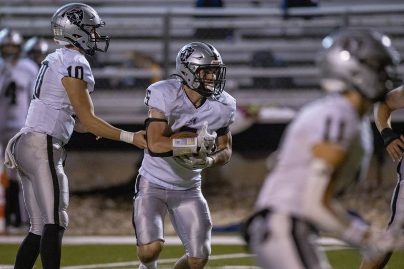 Josh Mauthe takes the handoff during the Kaneland-LaSalle Peru game on October 20, 2023 at Howard Fellows Stadium.