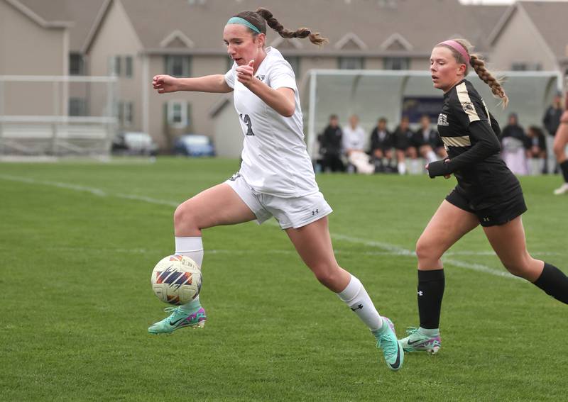 Kaneland's Kyra Lilly dribbles the ball ahead of Sycamore's Taylor Zemanek during their game Wednesday, April 17, 2024, at Sycamore High School.