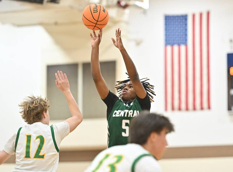 Plainfield Central's Treyvon Smith (5) shoots a jump shot over Providence Catholic's Reese Kras (12) during the WJOL tournament game on Friday, NOV. 28, 2025, at Joliet.