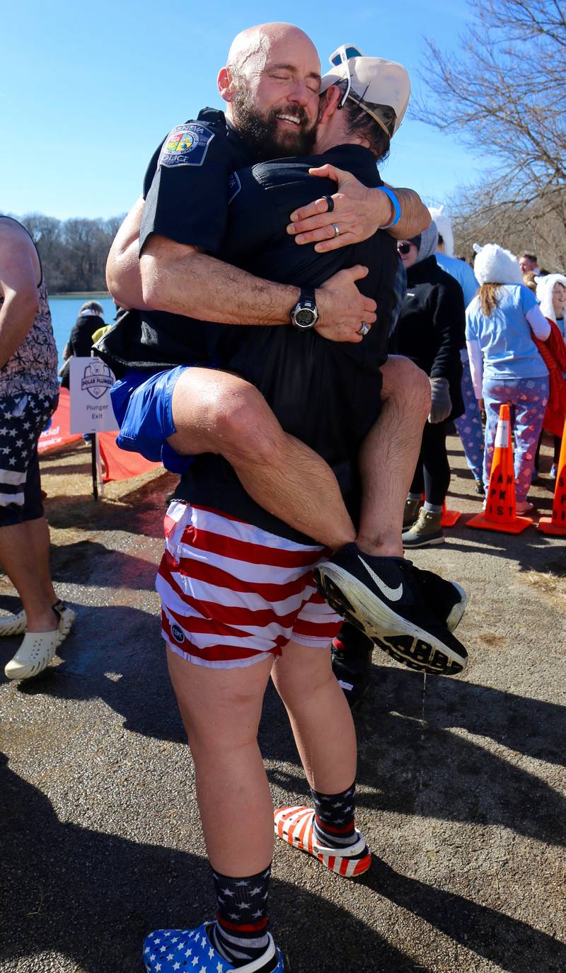 Geneva Police Officers, Chuck Parisi and Kaley Smith embrace after Officer Parisi’s final plunge at the Yorkville Polar Plunge on Sunday, March 2, 2025.