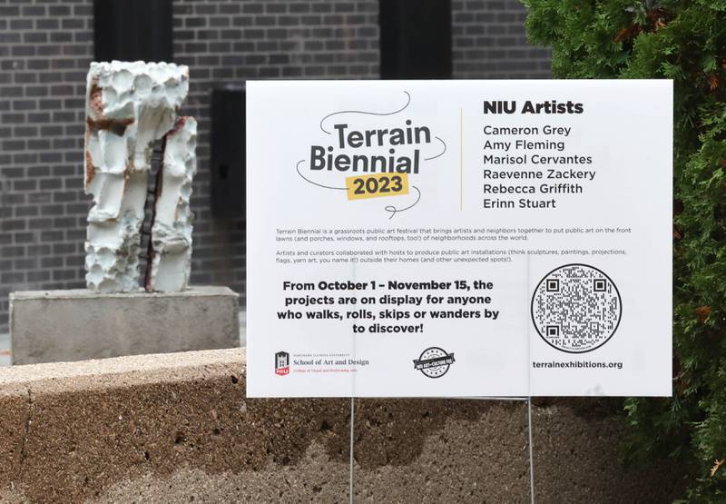 A portion of the sculpture "Foundations of Character" by Erinn Stuart Wednesday, Nov. 8, 2023, outside the Northern Illinois University School of Art and Design, Visual Arts Building. The piece is part of the Terrain Biennial 2023, a countrywide exhibit where artists display their work outside of homes and building around town.