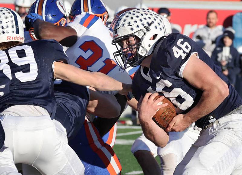 Cary-Grove's Logan Abrams looks for a hole in the East St. Louis defense Saturday, Nov. 25, 2023, during their IHSA Class 6A state championship game in Hancock Stadium at Illinois State University in Normal.