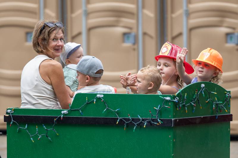 Kids ride on a train cart at the Touch a Truck event on Sunday, July 27, 2025, at Riverfront Park in Ottawa.