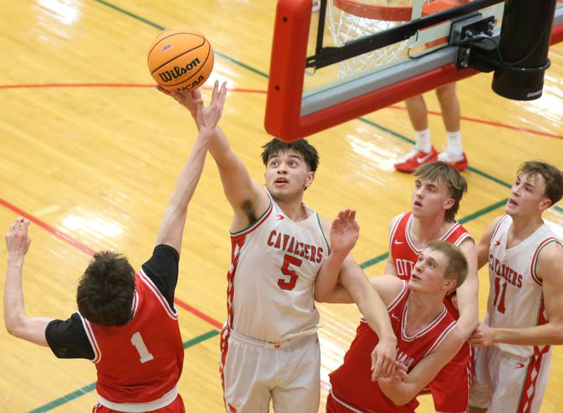 L-P's Erick Sotelo grabs a rebound over Ottawa's Colty Bryson during the Class 3A Regional title game on Wednesday, Feb. 25, 2026 in Sellett Gymnasium at L-P High School.