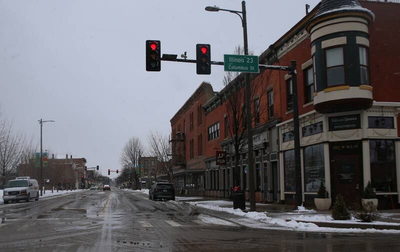 Light snow falls on the corner of Route 23 and Main Street on Tuesday, Jan. 9, 2024 downtown Ottawa.