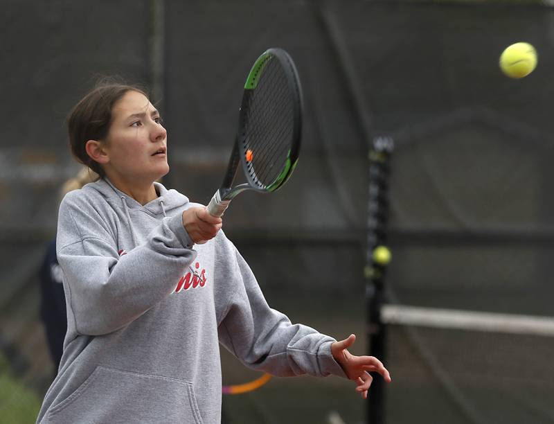 Ottawa’s Emma Walker returns the ball Thursday, Oct. 20, 2022, during during the first day of the IHSA State Girls Tennis Tournament at Schaumburg High School in Schaumburg.