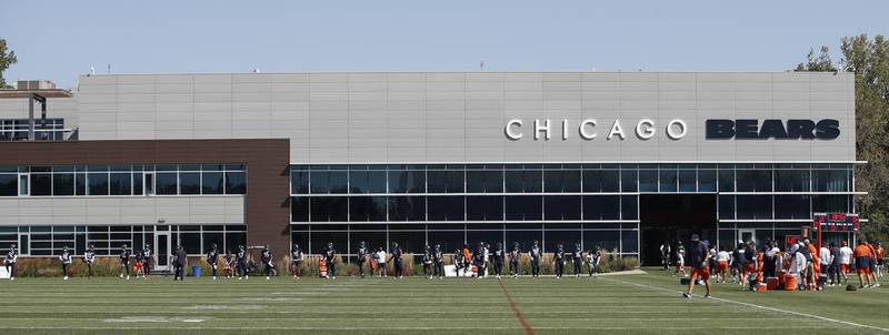 Chicago Bears players warm up and stretch during training camp Sept. 3 at Halas Hall in Lake Forest.