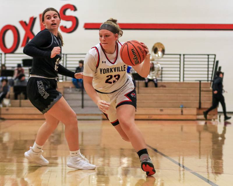 Yorkville's Courtney Morse (23) takes off towards the basket during varsity basketball game between Kaneland at Yorkville. Dec 14, 2022.